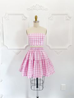 "The Petticoat Lane set is what summer outfit dreams are made of! Super limited edition pink gingham print inspired by everyone's favourite doll.  Skirt measures 18-20\" long from top of waistband depending on size. ♡ The Jordan de Ruiter collection is hand crafted in Canada in-studio & by small run manufacturers. Made to order, please see the shipping section for current turnaround on this item. Please choose the size that is closest to your measurements. If you are unsure please send your exac Summer Gingham Dress With Tiered Skirt, Spring Picnic Skirt With Ruffles, Fitted Cotton Skirt For Picnic, Fitted Gingham Skirt For Summer, Gingham Skirt For Summer Picnic, Summer Gingham Skirt For Picnic, Pink Summer Dress With Gathered Skirt, Summer Pink Dress With Gathered Skirt, Plaid Fitted Skirt For Picnic