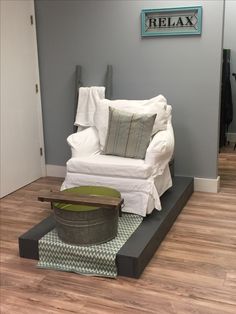 a white chair sitting on top of a hard wood floor