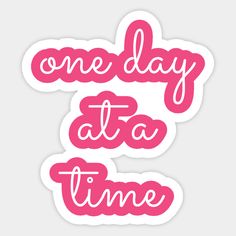 two stickers that say one day at a time and the other is pink with white lettering