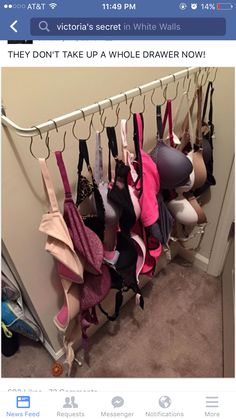 a bunch of bras are hanging up on the wall