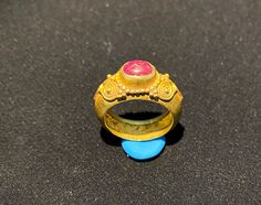 A beautiful gold ring probably from south east Asia  very good condition  A beautiful small Ruby light stone is placed in this gold ring  The weight of the ring is 4.62 grams  we can provide gold certificate as well on request of customers  The percentage of gold of this ring is 75 percent which means 18 karat gold  we provide fast and free shipping to our customers by which can get the items by maximum 7 working days Oval Gold Ruby Ring For Ceremonial Occasions, Oval Ruby Ring In Gold For Ceremonial Occasions, Ancient Oval Gold Rings, Ancient Gold Ring, Beautiful Gold Rings, Gold Certificate, South East Asia, East Asia, Southeast Asia