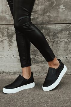 Your classic sneaker gets a major upgrade with the Lulus Cassay Black Crocodile-Embossed Platform Slip-On Sneakers! Matte crocodile-embossed faux leather shapes these slip-on sneakers that have a rounded toe upper and elastic gussets for fit. Pull tab at back. 1.5"" white bumper sole. 1. 5" Platform Sole. Lightly Cushioned Insole. Rubber Sole Has Nonskid Markings. All Man Made Materials. Imported. Lulus | Cassay Black Crocodile-Embossed Platform Slip-On Sneakers | Size 7. Nyc Wardrobe, Black Platform Sneakers, Slip On Tennis Shoes, Platform Slip On Sneakers, Black Tennis Shoes, Black Casual Shoes, Black Slip On Sneakers, Tennis Shoes Outfit, Vegan Leather Leggings