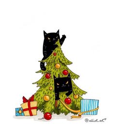 a black cat sitting on top of a christmas tree