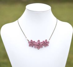 "Featuring Trio Pale Mauve Succulent Centered Necklace, Pale pink Purple Succulent Necklace, Succulent wedding Jewelry, Succulent Jewelry All Succulents Jewelry available at below link: https://www.etsy.com/shop/Diaszabo?ref=listing-shop2-all-items-count&section_id=20503443 Material and size : Hand wired Trio Succulents. Size approximately 25-26mm and 30mm across. Cream Swarovski pearls. Antiqued brass chain ( pictured). Available in silver plated, gold plated. The entire length available in Purple Flower Pendant Necklace For Gift, Ruby Necklace Succulent, Pink Flower-shaped Necklaces For Mother's Day, Elegant Purple Flower-shaped Necklace, Succulent Jewelry, Purple Succulents, Pink Flower-shaped Necklaces With Roses, Succulent Wedding, Bib Necklaces