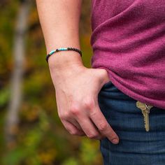 This lava bracelet with turquoise and gold is classic and timeless. The combination of tiny lava stone beads, turquoise beads, and yellow gold spacers make it perfect for both men and women. Perfect alone or stacked in groups, these small bracelets add the perfect touch of rugged sophistication to any outfit. The band on these bracelets is slightly elastic, which lets you put it on without having to operate a closure. The Lava Beads can also be used to absorb essential oils, due to their porous Meteorite Necklace, Jewelry By Johan, Country Rings, Lava Stone Bracelet, Lava Bracelet, Bone Necklace, Turquoise And Gold, Small Bracelets, Lava Beads