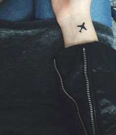 a person with a small tattoo on their wrist