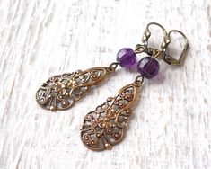 Lovely long victorian style brass filigree pendant earrings. The oxidized brass victorian pendants are complimented with genuine faceted amethyst beads. Stunning! The lever back earwire is made of oxidized brass. The length of the earrings including the hook is ± 5.5 cm. (2.2  inches) The oxidized brass components are made in the USA, most pieces are stampings made of antique dies from the 19th century. They are oxidized for a lovely antique bronze patina and durability.   For other jewelry plea Victorian Brass Earrings With Vintage Charm, Purple Brass Drop Earrings, Ornate Purple Drop Earrings, Vintage Purple Filigree Jewelry, Purple Bohemian Filigree Jewelry, Bohemian Purple Filigree Jewelry, Purple Vintage Jewelry, Victorian Filigree, Victorian Pendants