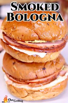 three hamburgers stacked on top of each other with the words smoked bologna above them