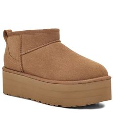 This is one of UGG's most precious styles, and oh, do they have the viral-status receipts to prove it. This ultra, elevated Classic boot is a must-have combination of newness and nostalgia. It's made with rich suede and lined inside with UGGplush� blend for signature softness.The outsole of this product is either a sugarcane EVA outsole, which is a responsible compound using sugarcane foam that allows UGG to reduce dependency on fossil fuels by replacing petroleum-bas Platform Boots Women, Ugg Classic Ultra Mini, Fossil Fuels, Ugg Classic, Classic Boots, Boot Brands, Winter Boots Women, Prove It, Christmas Wishlist