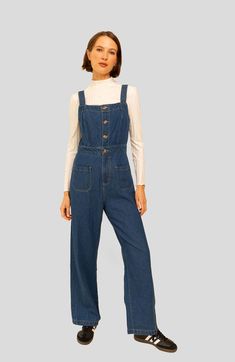 Crafted from organic cotton dark denim, our Grace Jumpsuit is the perfect transitional piece. Featuring overalls with front and back patch pockets, as well as a four-button front closure and high waist, the jumpsuit flows into wide-leg pants for an ankle-grazing length. Adorned with undeniable charm yet ultra-comfortable, this classic wardrobe staple is great for layering. True to size Button front Front Zipper Adjustable straps For best results wash on delicate cycle (or hand wash) on cold with Utility Style Dark Wash Denim Jumpsuit With Bib Front, Dark Wash Utility Denim Jumpsuit With Bib Front, Fall Medium Wash Bib Front Denim Jumpsuit, Cotton Utility Denim Jumpsuit With Button Closure, Utility Cotton Denim Jumpsuit With Button Closure, Denim Blue Bib Front Utility Jumpsuit, Utility Denim Blue Jumpsuit With Bib Front, Utility Style Denim Blue Bib Front Jumpsuit, Relaxed Fit Denim Jumpsuit With Patch Pockets