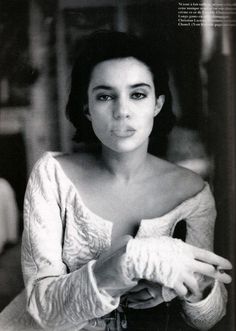 a black and white photo of a woman wearing gloves