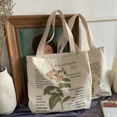 Botanic Shoulder Bag – Boogzel Apparel Casual Canvas Shoulder Bag Gift, Beige Satchel With Letter Print, Beige Letter Print Tote Bag, Beige Satchel Bag With Letter Print, Travel Shoulder Bag With Letter Print, Casual Shoulder Gift Bag, Casual Gift Shoulder Bag, Casual Shoulder Bag Suitable As Gift Bag, Beige Canvas Bag With Letter Print