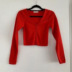 High Quality Cotton Sweater. Thick And Stretchy, Slightly Cropped. From Urban Outfitters, Beautiful Red Color. Brand New, Worn Only To Try On. Missing Tags. Originally $60. Red Crop Cardigan, Trendy Red V-neck Cardigan, Red Fitted V-neck Outerwear, Red V-neck Top For Layering, Red Stretch Casual Cardigan, Casual Red Stretch Cardigan, Red V-neck Sweater For Spring, Trendy Red V-neck Sweater, Fitted Red Cardigan