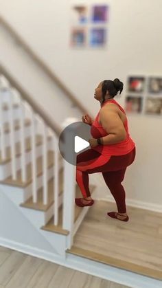 a woman standing in front of a stair case