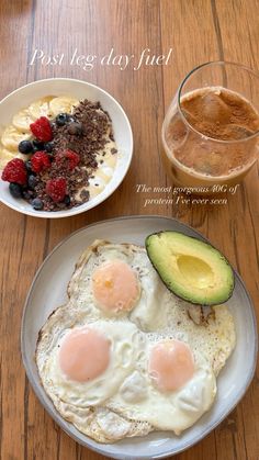 two plates with eggs, fruit and yogurt on them next to a glass of water