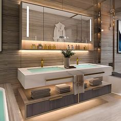 a large bathroom with two sinks and a bathtub in the middle, surrounded by mirrors