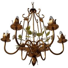 a chandelier with flowers and leaves on it