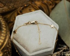 Our Six Star Stations Bracelet will accessorize your wrist in a dainty and graceful way, assuring that you look polished and whimsical at the same time. NECKLACE DETAILS: Length: 7.25 Inches Millimeter: 0.80 Gauge: 025 Closure: Lobster Average Weight (g): 1.60 Available in 14K Yellow Gold ***These necklaces have a 4 week lead time. If you need your necklace sooner than that, please contact us prior to ordering to verify if that's possible.*** | Adjustable 6-Star Stations Bracelet In 14K Yellow Gold Ring - by Staghead Designs - Unisex Time Necklace, Redwood Wedding, Look Polished, Staghead Designs, Average Weight, Ring Fit, Lead Time, Yellow Gold Rings, Gold Ring