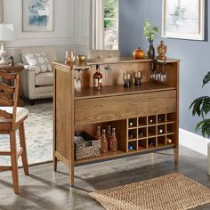 a living room filled with furniture and a wine rack on top of a wooden table