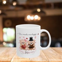 a coffee mug with two teddy bears on it that says, you make me happy love