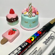 there are three different types of cakes and crayons next to each other on the table