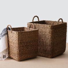 two woven baskets sitting next to each other