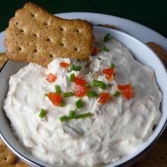 crackers and dip in a bowl on a plate