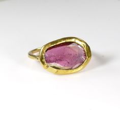 "𝗪𝗔𝗡𝗧 𝟭𝟬% 𝗢𝗙𝗙 𝗧𝗢𝗗𝗔𝗬? Get your code at https://bit.ly/2Jlkfoz (Just copy and paste that into your browser.). --------------------------------------------------------------- If you love pink this ring is clearly for you. The inclusions in the stone will just mesmerize you when this dramatic ring sparkles on your finger. This 22k pink tourmaline ring was designed so that the light goes through the gemstone slice, with a precious but frame. It had a wonderful raw organic feel, perfect Gold Tourmaline Ring With Accent Stones, Gold Tourmaline Gemstone Rings, Pink Ruby Open Ring With Gemstone, Modern Pink Gemstone Rings, Faceted Tourmaline Ring Gift, Pink Tourmaline Gemstone Rings, Modern Pink Ruby Ring As A Gift, Modern Pink Ruby Ring For Gift, Elegant Pink Ring With Large Stone