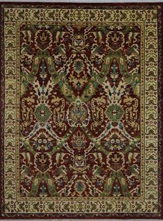 a red and green rug with an ornate design