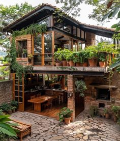 a house with plants growing on the roof