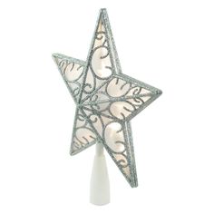 a decorative glass star ornament on a white stand