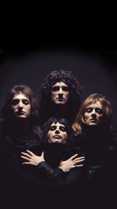 the band queen of rock and roll posing for a photo