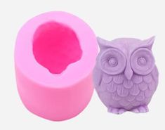 an owl shaped object next to a pink rubber tube with a hole in the middle