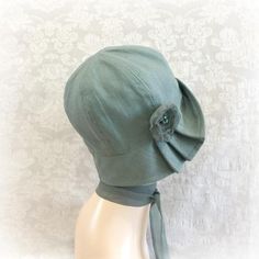 1920's Style Linen Hat with Pleated Brim and Flower | The Polly Cloche Fitted Brimmed Bonnet For Summer, Fitted Bonnet Cap For Spring, Adjustable Bonnet For Spring, Adjustable Green Cloche Hat, Vintage Bonnet With Adjustable Short Brim, Vintage Adjustable Bonnet With Short Brim, Vintage Short Brim Bonnet With Adjustable Fit, Spring Green Adjustable Cloche Hat, Adjustable Brimmed Spring Bonnet