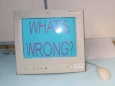 an old computer monitor with the words what's wrong? written on its screen