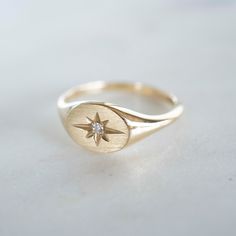 14k Solid Gold Starburst Signet Ring Our new stunning 14k Solid Gold Signet Ring is a timeless addition to your ring collection. Featuring a genuine .025 Carat diamond Closed back. Face comes standard in a polish finished, but we can make it in a matte finish upon request. Built to last a lifetime and more. Please allow an additional 3 - 5 business days for processing on our solid gold and diamond pieces. Signet Ring Diamond, Diamond Signet Ring, Gold Starburst, Gold Signet Ring, Ring Collection, Engraved Items, Ring Diamond, Ring Collections, Signet Ring