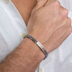 "Get your man something personal and stylish for a special occasion. The simple and beautiful bracelet made of stainless steel band  set with a stainless steel palette which you can engrave on it names, dates, initials, roman numerals, coordinates, message and signs. Bracelet comes with 2\" (5cm) extension chain.  These make the perfect gift. Every purchase comes packaged in a sweet box. It carefully protects items during the shipping and is perfect for gift giving or keeping for yourself.  Plea Customizable Silver Bracelet, Silver Bar Bracelet, Man Bars, Handmade Leather Bracelets, Mens Bracelet Silver, Bar Bracelet, Beads Bracelet Design, Beaded Jewelry Designs, Hand Bracelet