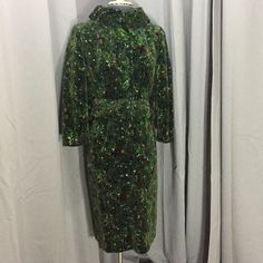 "Lovely 2 piece suit in a green multi color pattern. Inside label reads Lehmayers, York , Pa. Imported fabric Woven Italy. Suit is fully lined. Skirt has zipper & hook/ eye closure. Waist up to 26\". Length from waist to hem 27\". Jacket-features large fabric covered button down front. Collar can be worn up as shown or down. Belt at waist of same fabric. Bust up to 36\", waist up to 28\", length from center back to bottom 18 1/2\". Sleeve length underarm seam to cuff 13 1/2\". No size label. Tha Vintage Winter Blazer With Hidden Buttons, Vintage Winter Blazer With Hidden Button Closure, Vintage Velvet Party Outerwear, Retro Green Velvet Dress, Vintage Velvet Costume Outerwear, 70s Era, Velvet Suit, Fabric Covered Button, Covered Buttons