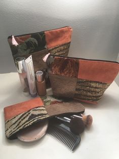 an assortment of makeup and hair products on a table