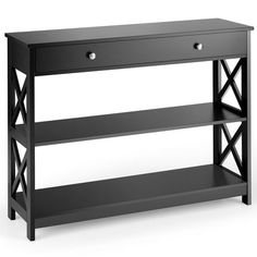 a black shelf with two drawers and one drawer on the bottom, in front of a white background