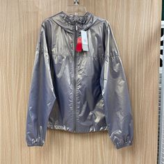 Zella Gray Iridescent Jacket Size S Nwt Raincoat Hooded Retails For $64.35 In Excellent Condition With No Rips Or Stains. Sold By Carousel Consignments In Okemos, Michigan. 4555-670/33/070224 Casual Hooded Metallic Outerwear, Iridescent Long Sleeve Outerwear For Spring, Spring Iridescent Long Sleeve Outerwear, Spring Hooded Windbreaker With Reflective Details, Hooded Reflective Outerwear For Fall, Metallic Hooded Winter Outerwear, Silver Hooded Outerwear For Streetwear, Casual Iridescent Long Sleeve Outerwear, Spring Outdoor Outerwear With Reflective Details