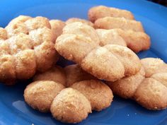 some sugar cookies are on a blue plate