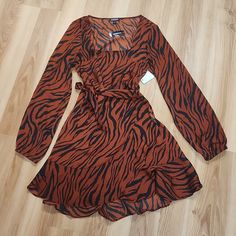 Nwt Express Animal Print Dress Sz. Small/P. A Must Have Casual Dress. Fabric Is Light & Cool. Great For Spring/Summer & Fall Trendy Long Sleeve Brown Dress, Brown Printed Dress For Fall, Chic Brown Printed Dress, Trendy Brown V-neck Dress, Brown Long Sleeve Mini Dress For Summer, Casual Brown Mini Dress For Party, Trendy Brown Dress For Day Out, Spring Printed Brown Mini Dress, Spring Brown Printed Mini Dress