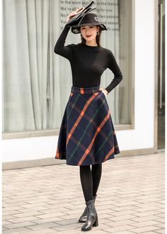 "This winter wool skirt is a classic piece of tailoring that will see you through rain or shine. It is cut with a flattering flared skirt to give you a wonderful shape. The winter skirt is perfect classic styling. This is a versatile skirt that you'll wear again and again. DETAILS: * 30% wool, 30% fiber, 40% polyester * fully satiny liner * Two side pockets * Right zip closure * A letter Back elastic, comfortable wear * Plus size full skirt * Perfect for Winter, autumn * Learn More about the ite Winter Knee-length Lined Pleated Skirt, Winter Lined Midi Pencil Skirt, Fall Workwear Full Mini Skirt, Full Mini Skirt For Workwear In Fall, Winter Knee-length Mini Skirt For Workwear, Relaxed Fit Knee-length Mini Skirt For Fall, Knee-length Mini Skirt With Relaxed Fit For Fall, Relaxed Knee-length Mini Skirt For Fall, Winter Pleated Mini Skirt