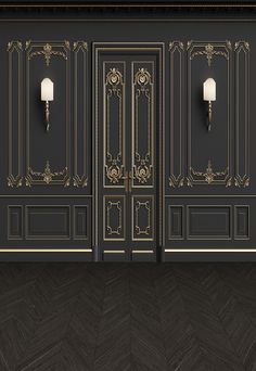 an empty room with black walls and gold trimmings on the doors is shown