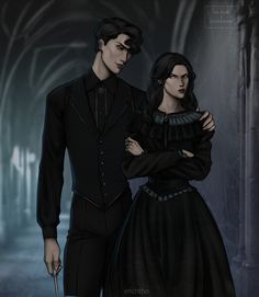 two people dressed in black standing next to each other