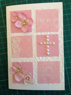 a card with pink flowers and pearls on it