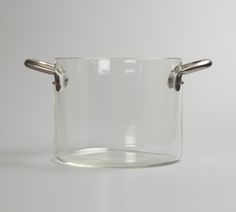 an empty glass pot with two handles