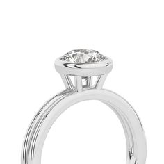 Crafted with exquisite detail, this Coupled Round Bezel Ring features a brilliant round lab-grown diamond nestled within a unique dual-band design. One band gleams in lustrous white gold, while the other elegantly contrasts in either romantic rose gold or striking yellow gold. All white gold option is also available. This solitaire diamond ring perfectly blends contemporary sophistication and classic charm, making it an ideal choice for engagements, anniversaries, or simply as a symbol of enduri 14k White Gold Diamond Ring With Tension Setting, Timeless Silver Diamond Ring With Round Band, Timeless Silver Diamond Ring, Timeless Silver Diamond Ring With Prong Setting, Timeless Silver Moissanite Diamond Ring, Timeless Moissanite Silver Diamond Ring, Modern Moissanite Round Cut Wedding Ring, Luxury Solitaire Diamond Ring With Round Stone, Luxury Solitaire Diamond Ring