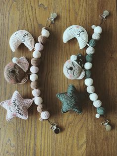 several crocheted items are laid out on the table together, including beads and hats